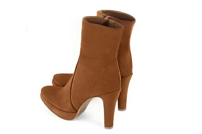 Caramel brown women's ankle boots with a zip on the inside. Round toe. Very high slim heel with a platform at the front. Rear view - Florence KOOIJMAN